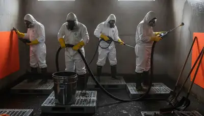 Sewage cleanup technicians servicing a Torrance, CA home after water damage with sanitation equipment